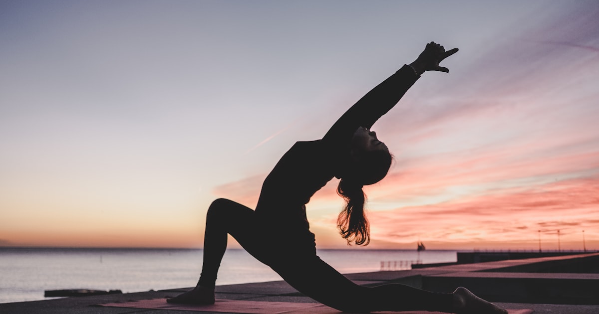 Woman practicing yoga for stress relief and recovery